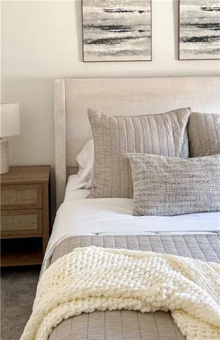 a bed room with a bed and a window