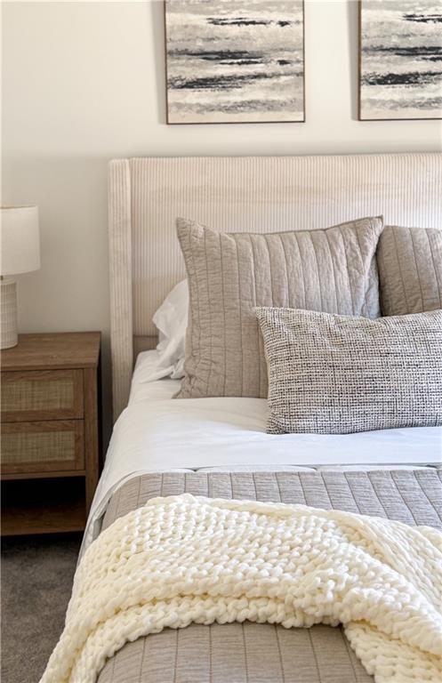 5736 Main Street Flowery Branch, GA 30542 - Photo 23 of 30 a bedroom with a bed and couch