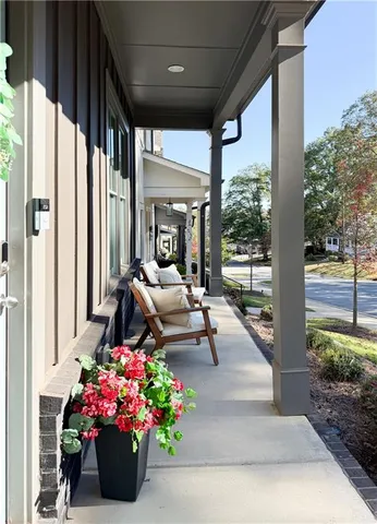 a lobby with furniture and flowers