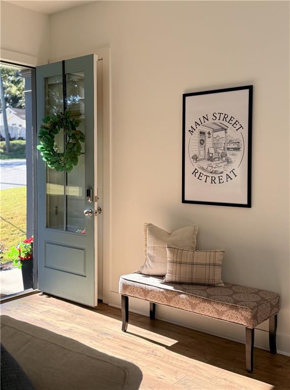 5736 Main Street Flowery Branch, GA 30542 - Photo 5 of 30 a living room with furniture and a potted plant