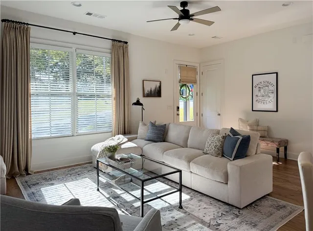 a living room with furniture and a window