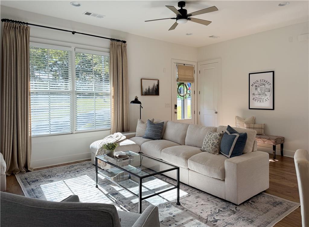 5736 Main Street Flowery Branch, GA 30542 - Photo 6 of 30 a living room with furniture and a window