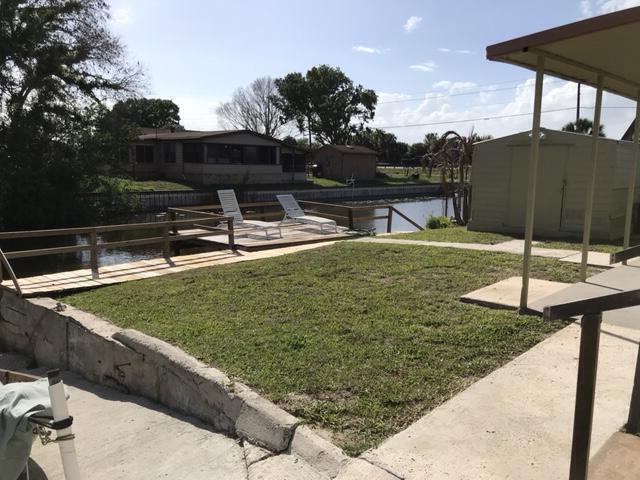 1038 8th Street Okeechobee, FL 34974 - Photo 13 of 17 a view of a backyard with sitting area