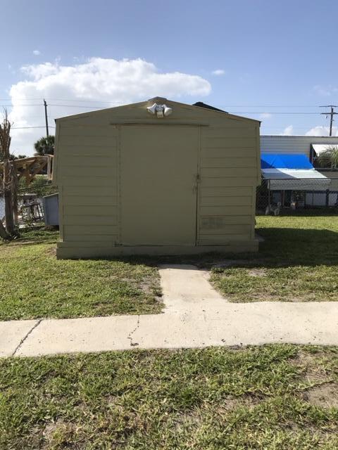 1038 8th Street Okeechobee, FL 34974 - Photo 17 of 17 a side view of a house