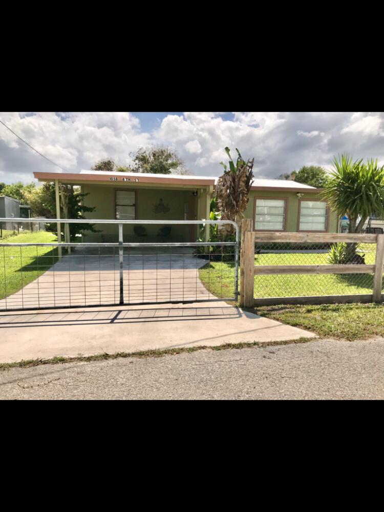 1038 8th Street Okeechobee, FL 34974 - Photo 2 of 17 a view of swimming pool with a yard