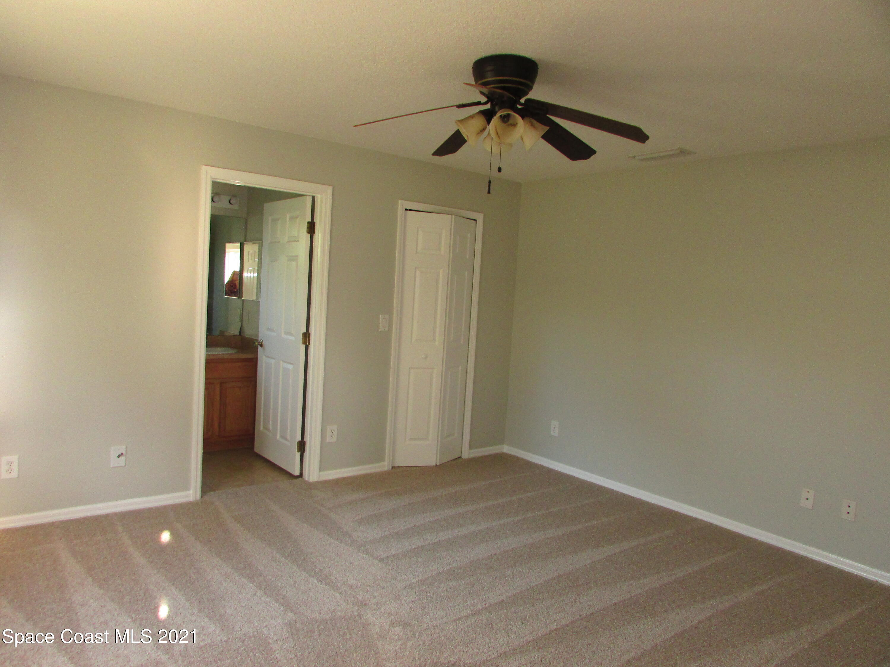 418 Titan Road Southeast Palm Bay, FL 32909 - Photo 7 of 15 Master Bedroom