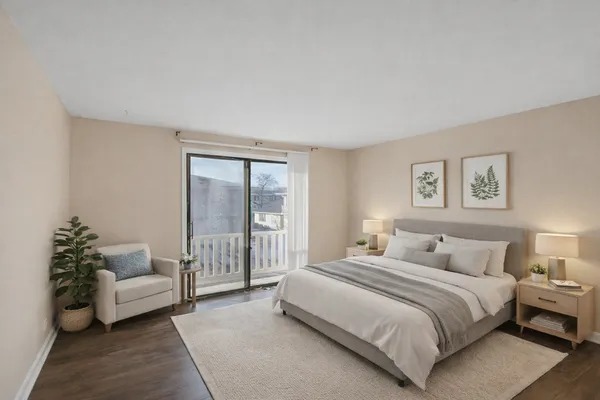 a bedroom with a bed and a couch