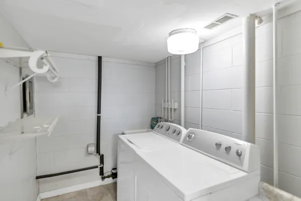 a bathroom with a sink a mirror and a shower