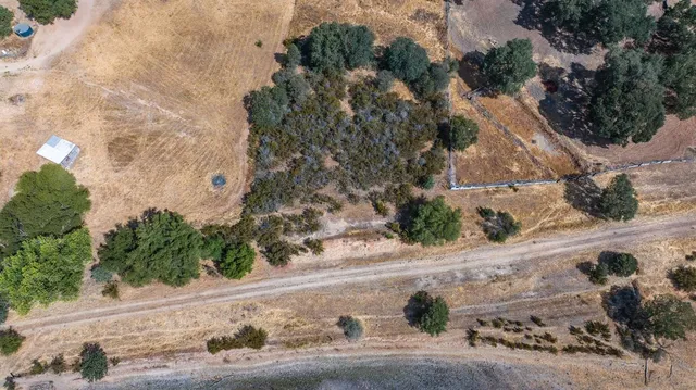 an aerial view of residential building and lake