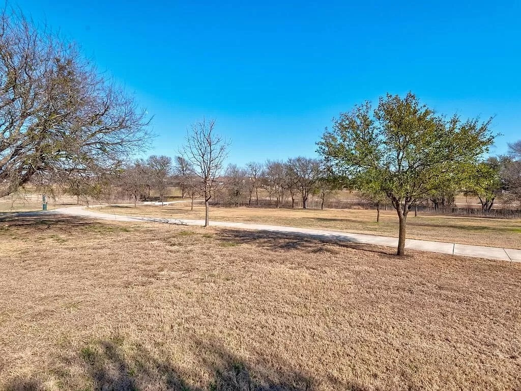 8217 Reggio Street Round Rock, TX 78665 - Photo 25 of 27 View of home's community with a lawn and a rural view
