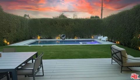 a view of a table and chairs in the garden