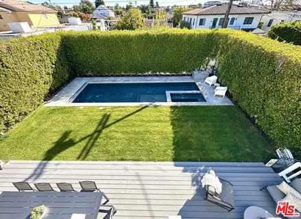 a view of swimming pool from a balcony