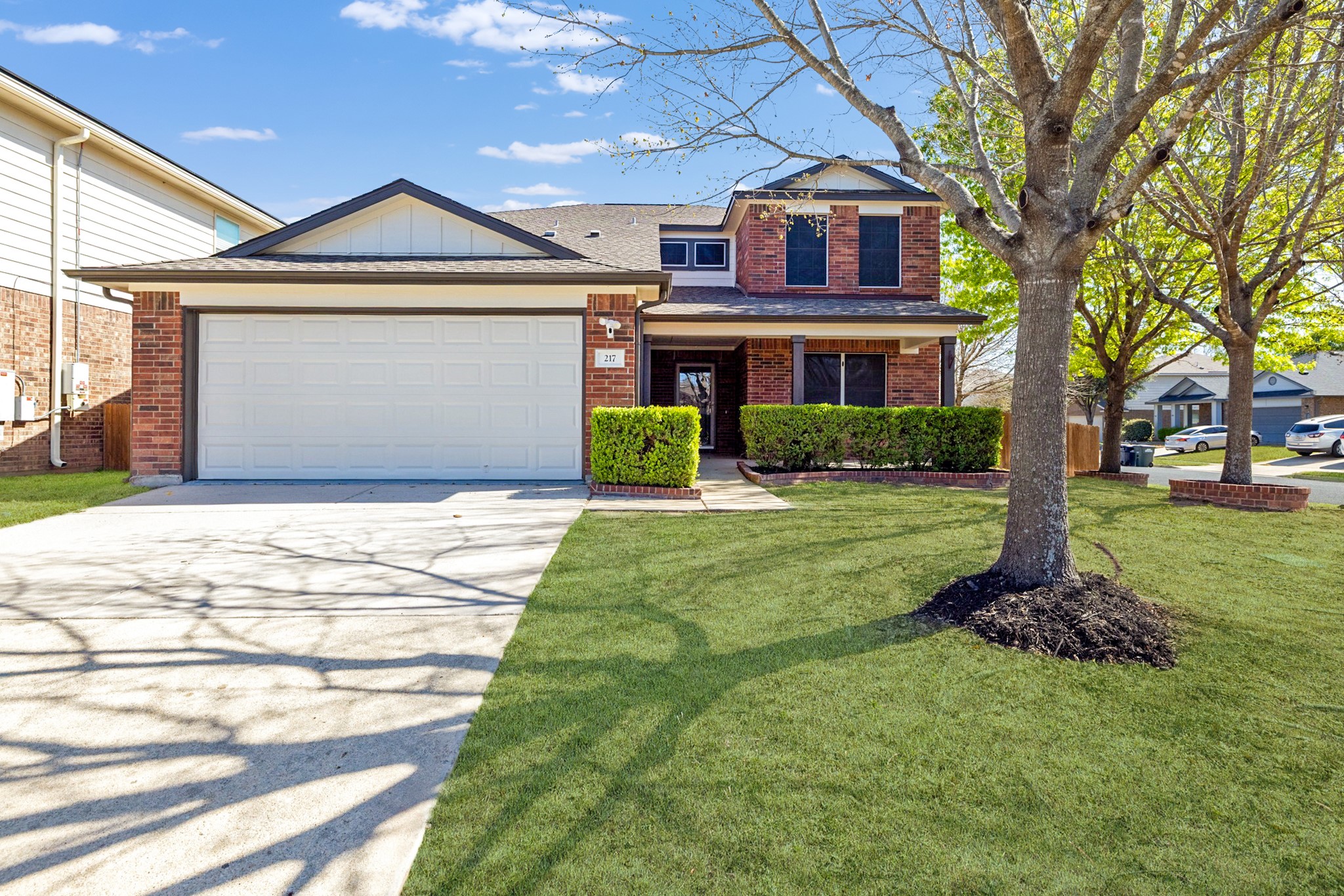 217 Inca Dove Lane Leander, TX 78641 - Photo 1 of 40 a front view of a house with a yard and garage