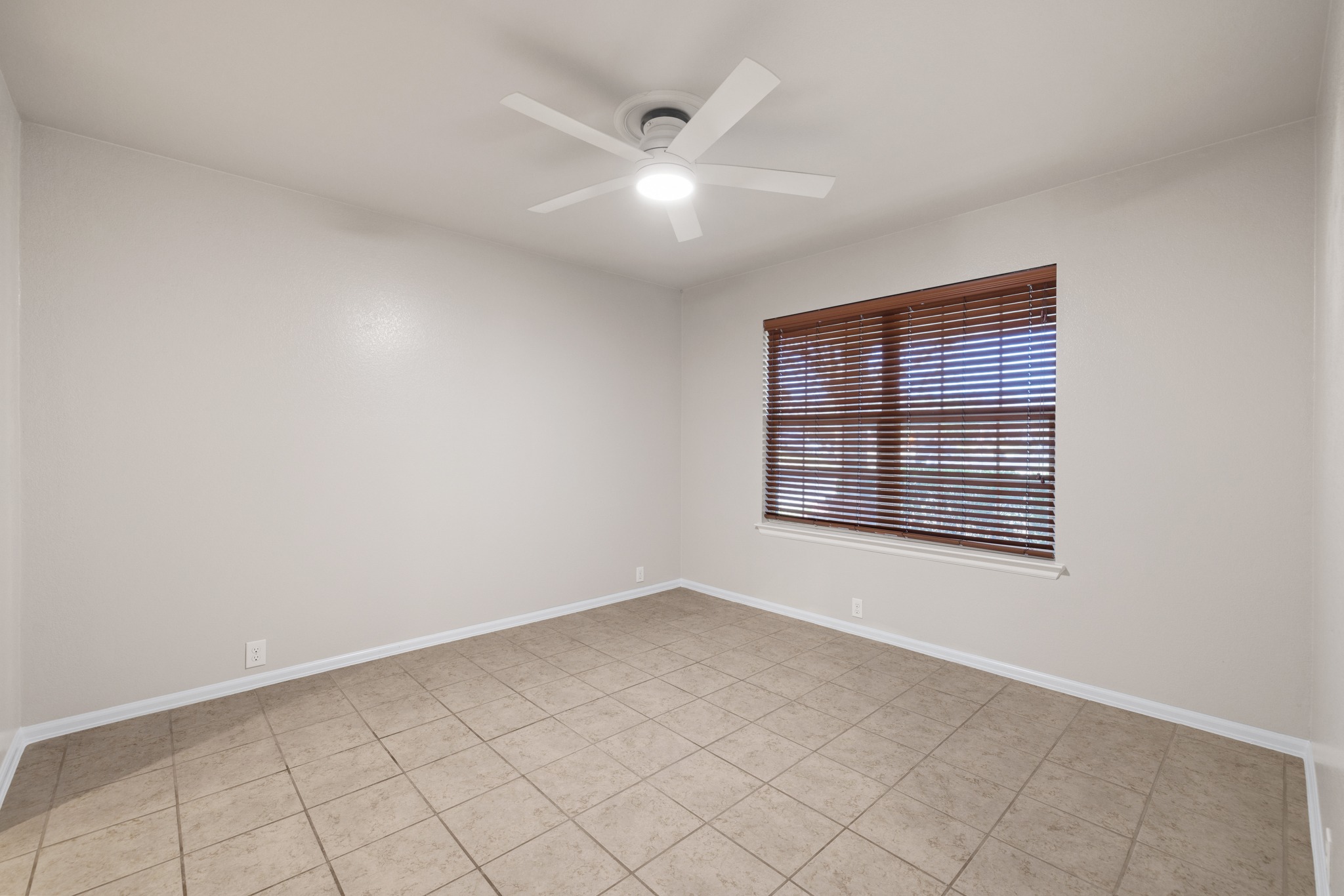 217 Inca Dove Lane Leander, TX 78641 - Photo 13 of 40 an empty room with windows and fan