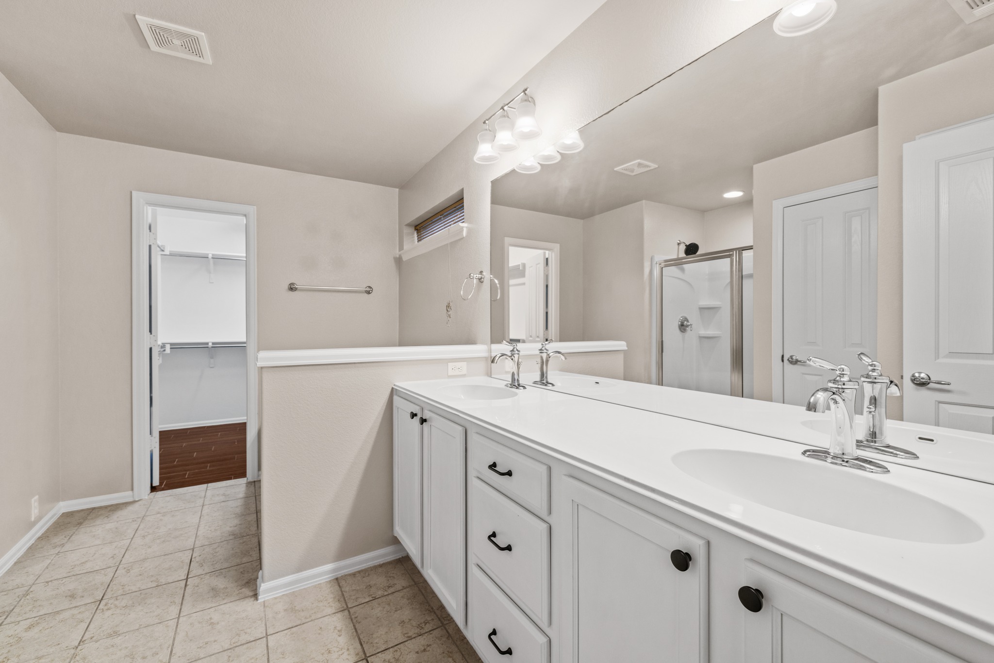 217 Inca Dove Lane Leander, TX 78641 - Photo 16 of 40 a spacious bathroom with a double vanity sink mirror and