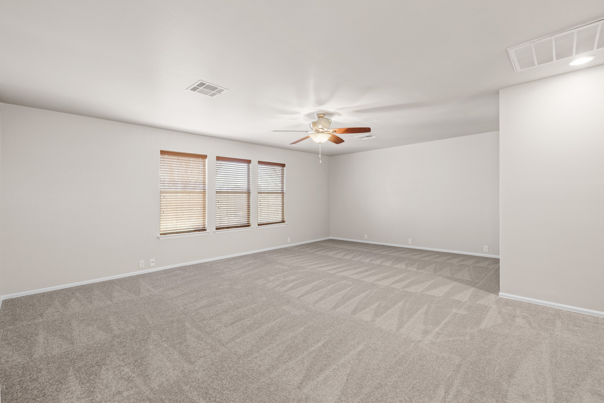 217 Inca Dove Lane Leander, TX 78641 - Photo 19 of 40 an empty room with windows and refrigerator