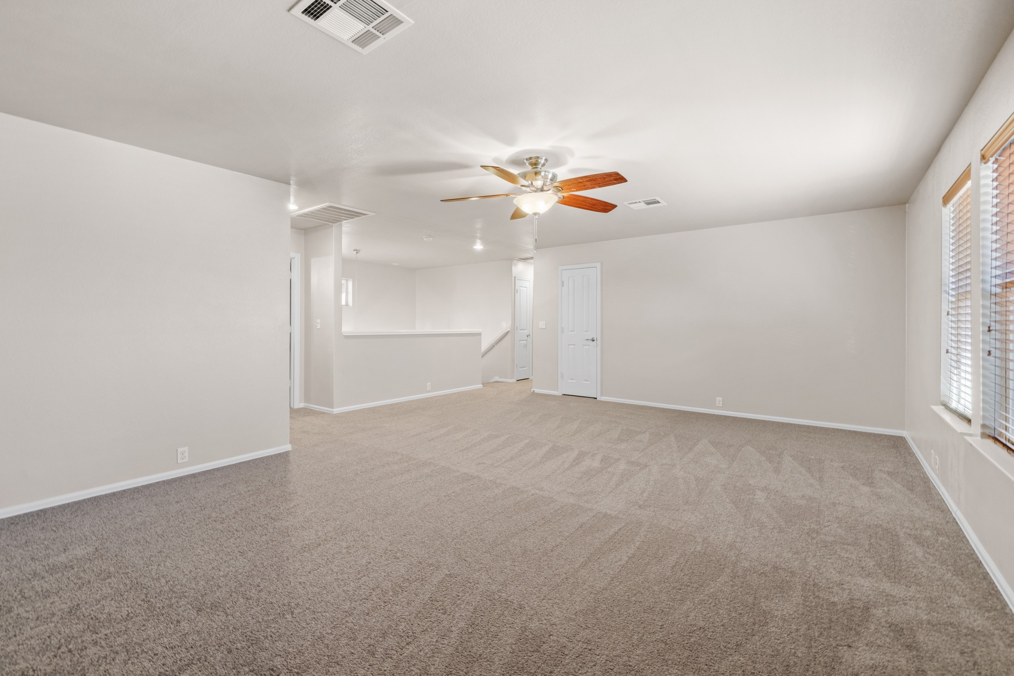 217 Inca Dove Lane Leander, TX 78641 - Photo 20 of 40 wooden floor in an empty room with a window