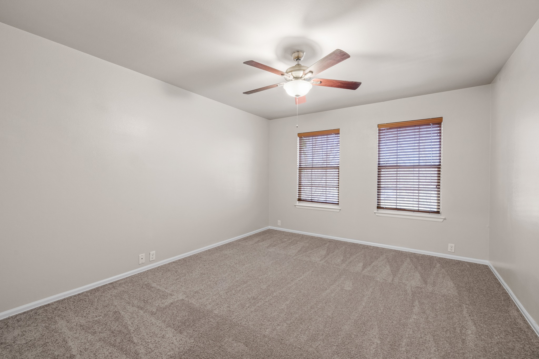 217 Inca Dove Lane Leander, TX 78641 - Photo 21 of 40 an empty room with windows and fan