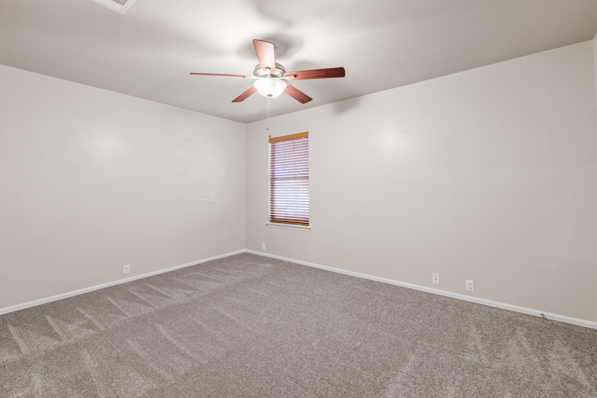 217 Inca Dove Lane Leander, TX 78641 - Photo 23 of 40 a view of an empty room with a chandelier fan