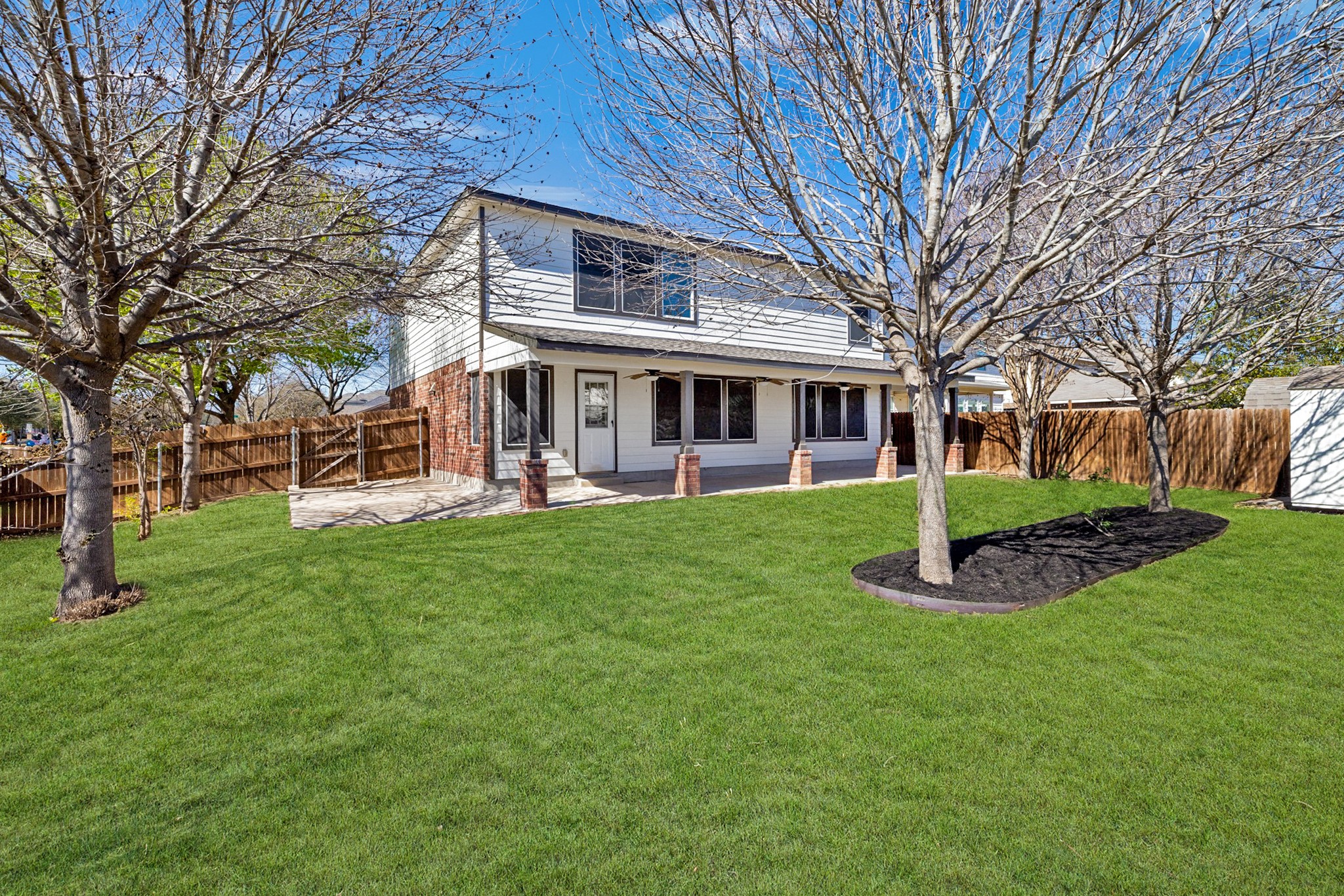 217 Inca Dove Lane Leander, TX 78641 - Photo 28 of 40 a view of a house with a backyard porch and sitting area