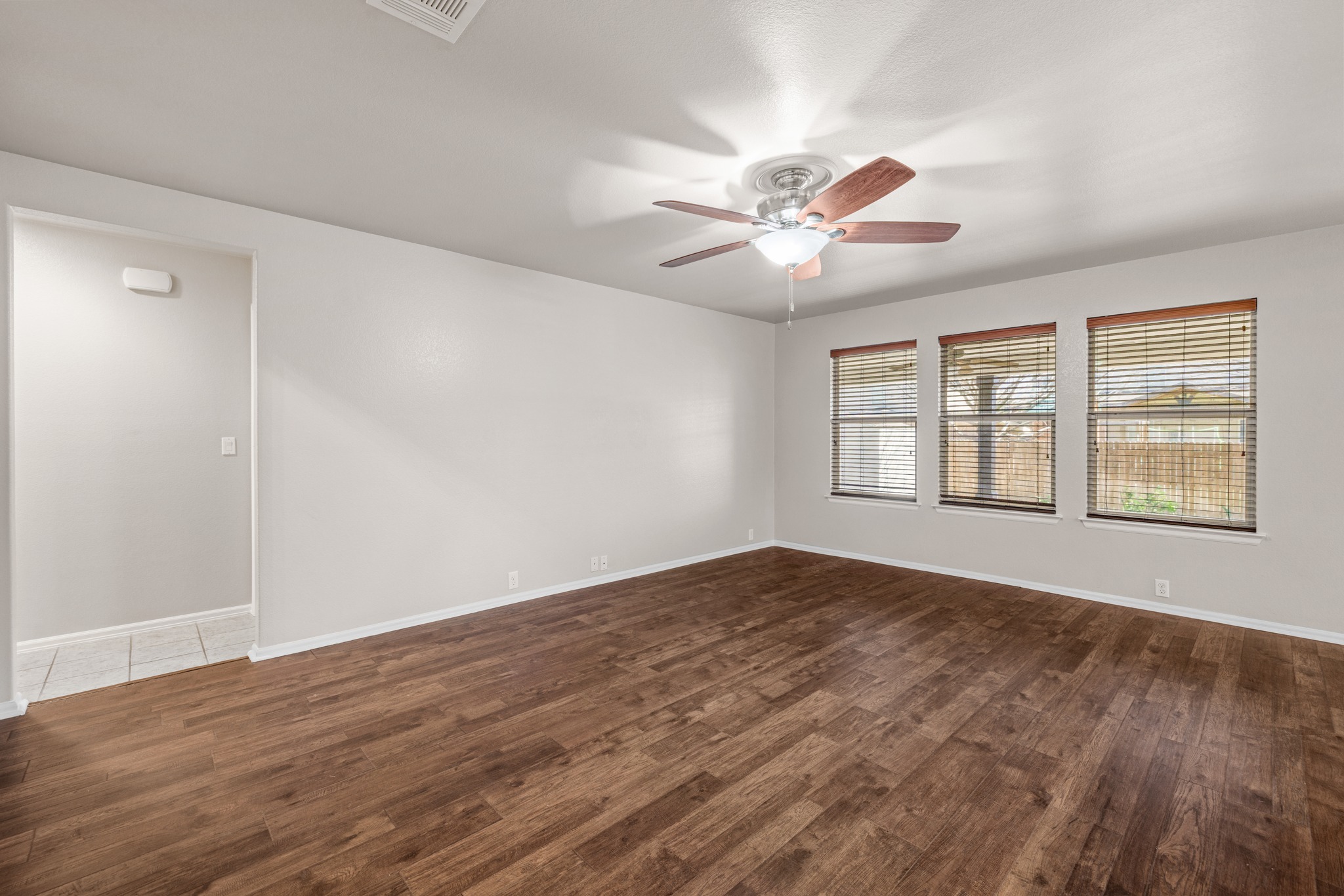 217 Inca Dove Lane Leander, TX 78641 - Photo 5 of 40 a view of an empty room with window and chandelier fan