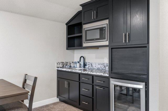 2178 Al Fonseca Lane Manteca, CA 95337 - Photo 20 of 46 a kitchen with a sink and microwave
