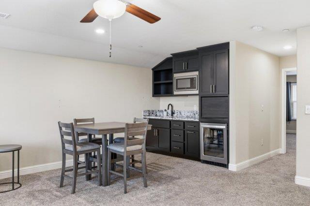 2178 Al Fonseca Lane Manteca, CA 95337 - Photo 21 of 46 a view of kitchen with sink stainless steel appliances and dining table