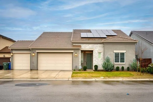 a view of a white house with a outdoor space