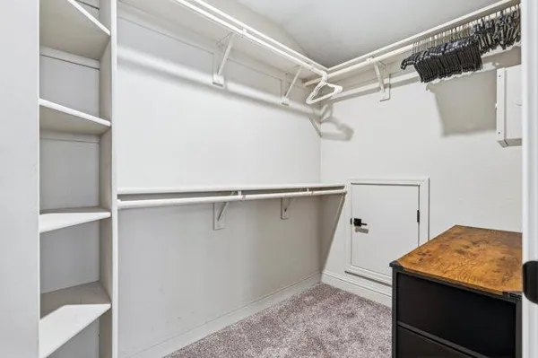 a living room with furniture a ceiling fan and a window