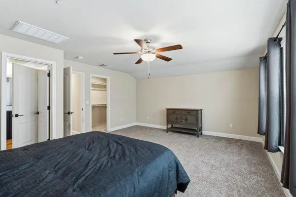 a front view of a house with a patio and a yard