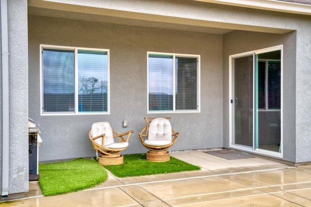 2178 Al Fonseca Lane Manteca, CA 95337 - Photo 37 of 46 a front view of a house with a patio and a yard