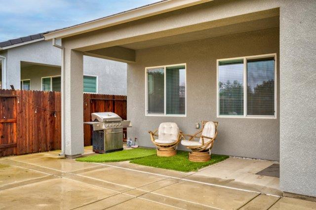 2178 Al Fonseca Lane Manteca, CA 95337 - Photo 40 of 46 a living room with patio furniture and a fireplace