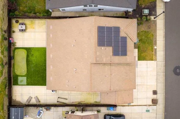 a white toilet sitting next to a bath tub