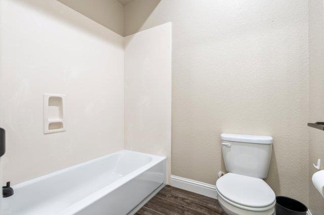 2178 Al Fonseca Lane Manteca, CA 95337 - Photo 46 of 46 a white toilet sitting next to a bath tub