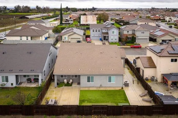 an aerial view of a house with a swimming pool