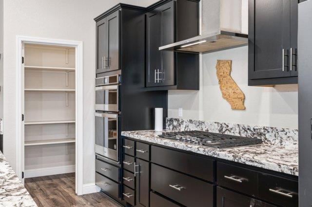2178 Al Fonseca Lane Manteca, CA 95337 - Photo 10 of 46 a kitchen with a sink a stove and cabinets