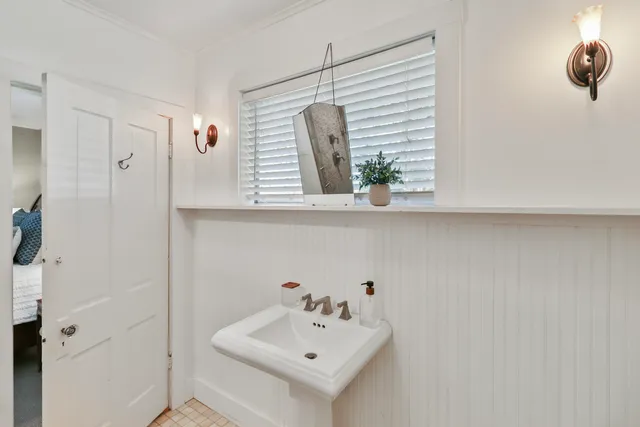 a bathroom with a shower and a sink