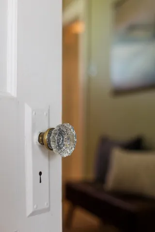 a bedroom with a bed and a couch