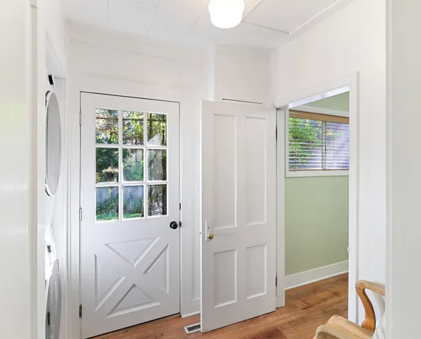 a view of front door with wooden floor