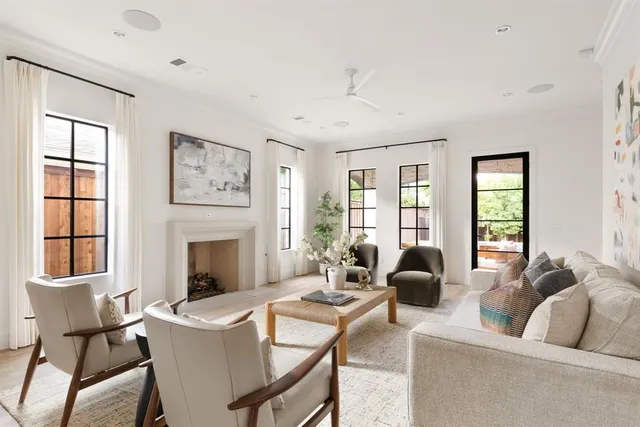 a living room with furniture fireplace and window