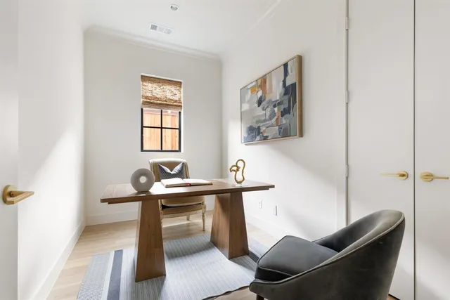 a kitchen with a sink a counter and cabinets