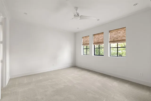 a bathroom with a sink toilet vanity and shower