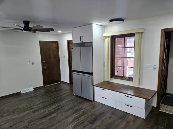 a kitchen with stainless steel appliances granite countertop a refrigerator and a sink