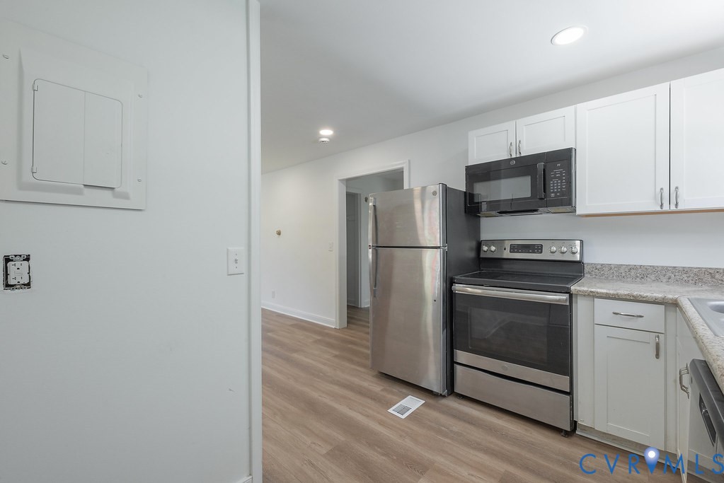 3400 Ryburn Road Richmond, VA 23234 - Photo 17 of 45 Modern kitchen featuring stainless steel appliance