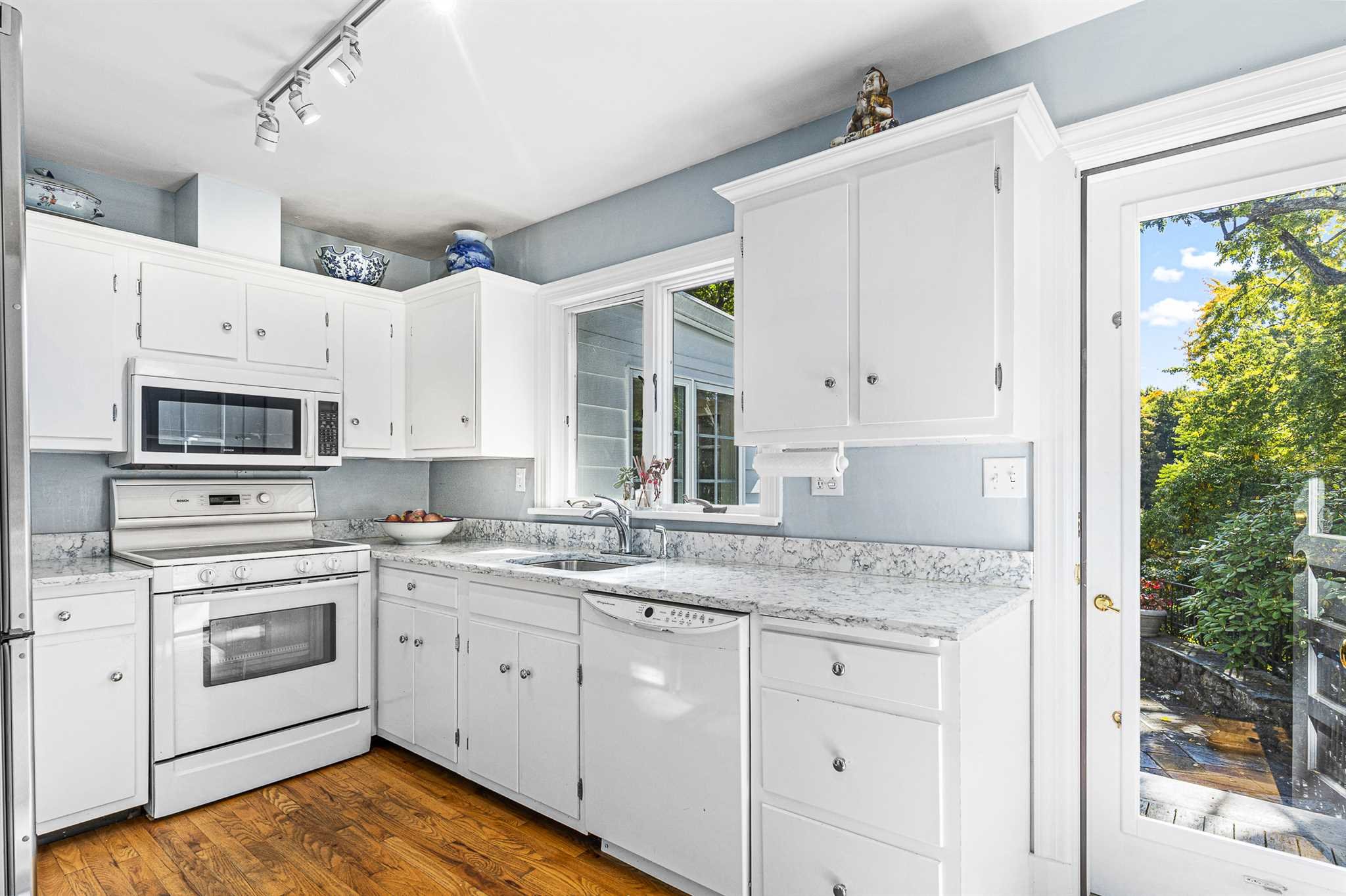 78 Maple Avenue Millbrook, NY 12545 - Photo 19 of 35 a kitchen with granite countertop white cabinets and white appliances