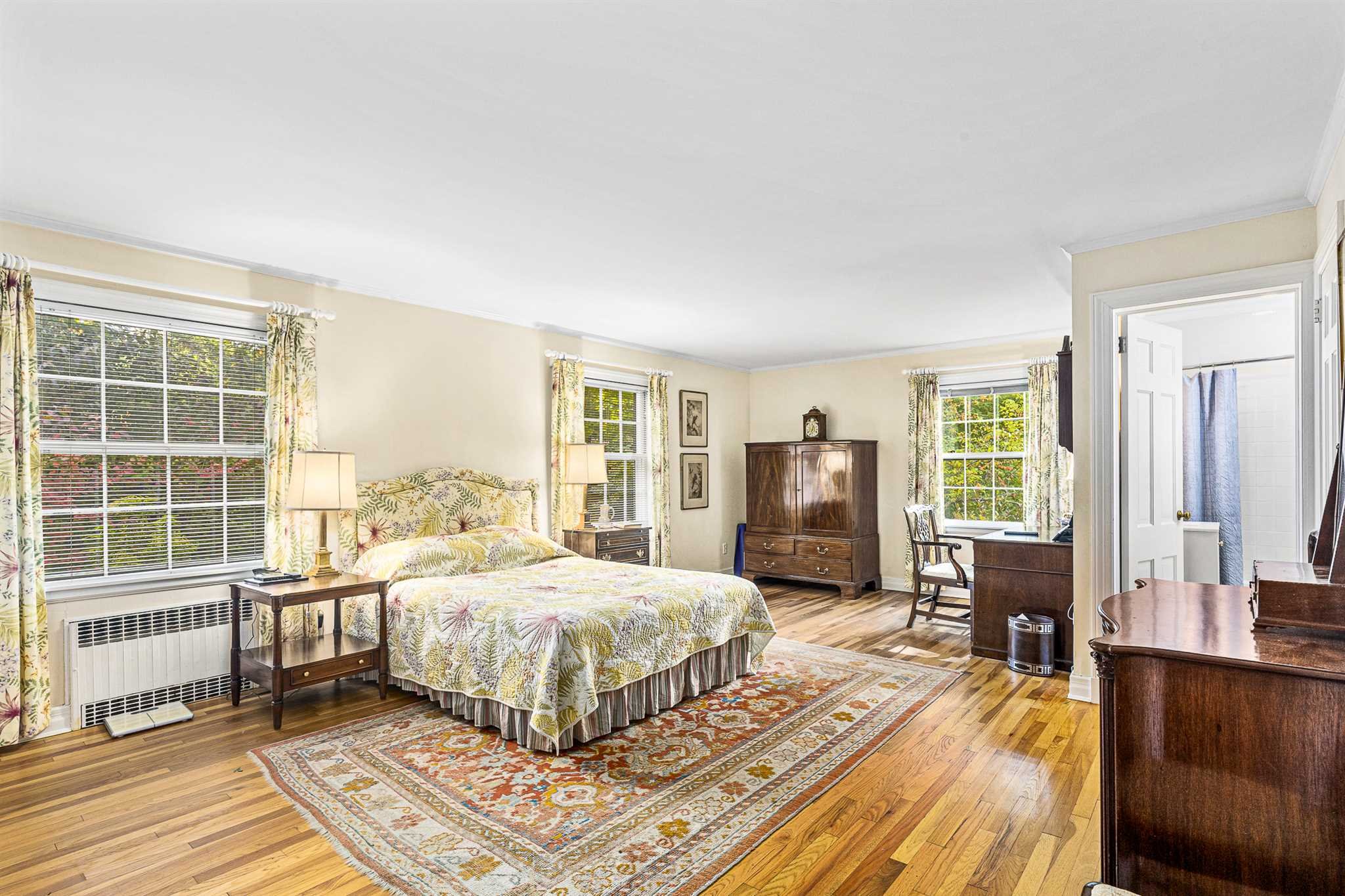 78 Maple Avenue Millbrook, NY 12545 - Photo 20 of 35 a bedroom with a bed wooden floor and large window