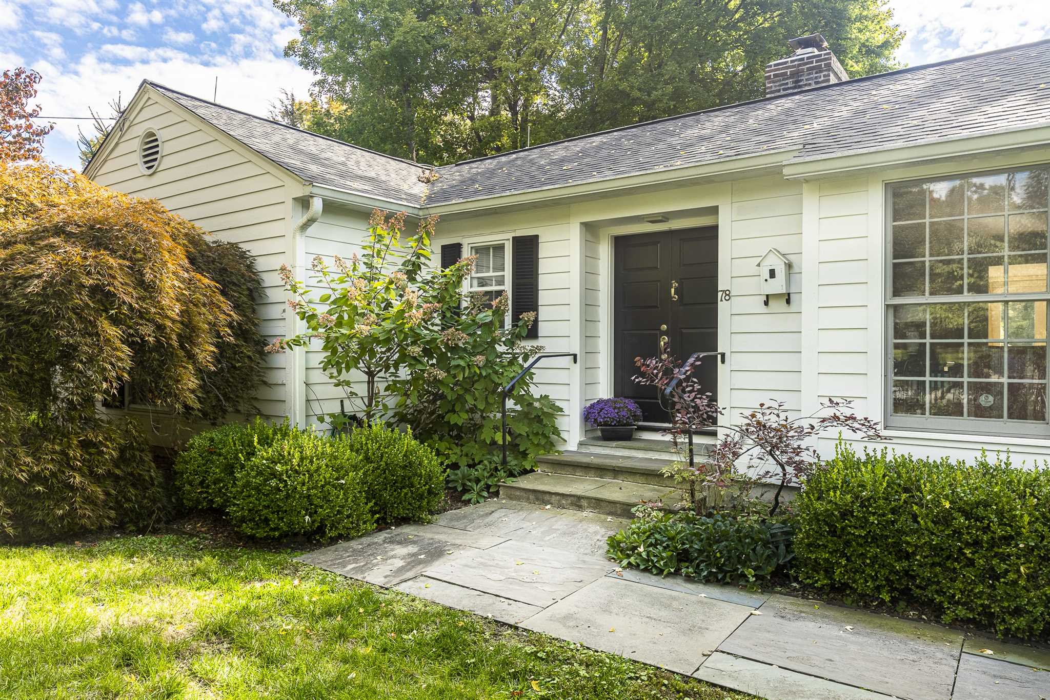 78 Maple Avenue Millbrook, NY 12545 - Photo 4 of 35 a view of a house with potted plants and a table and chairs