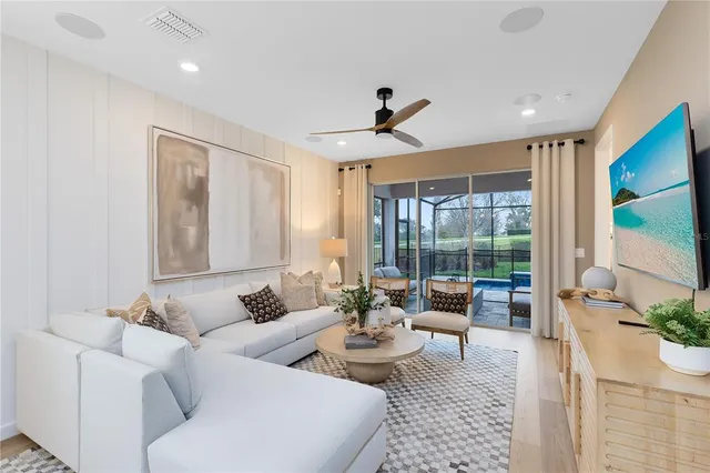 a living room with furniture and a large window