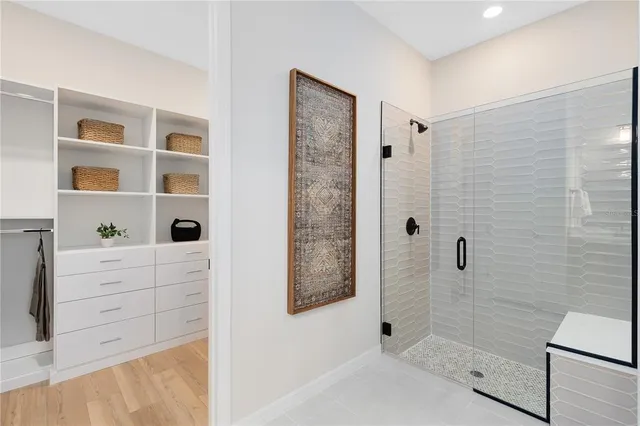 a bathroom with a bathtub and shower