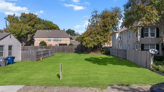 an aerial view of a house with outdoor space